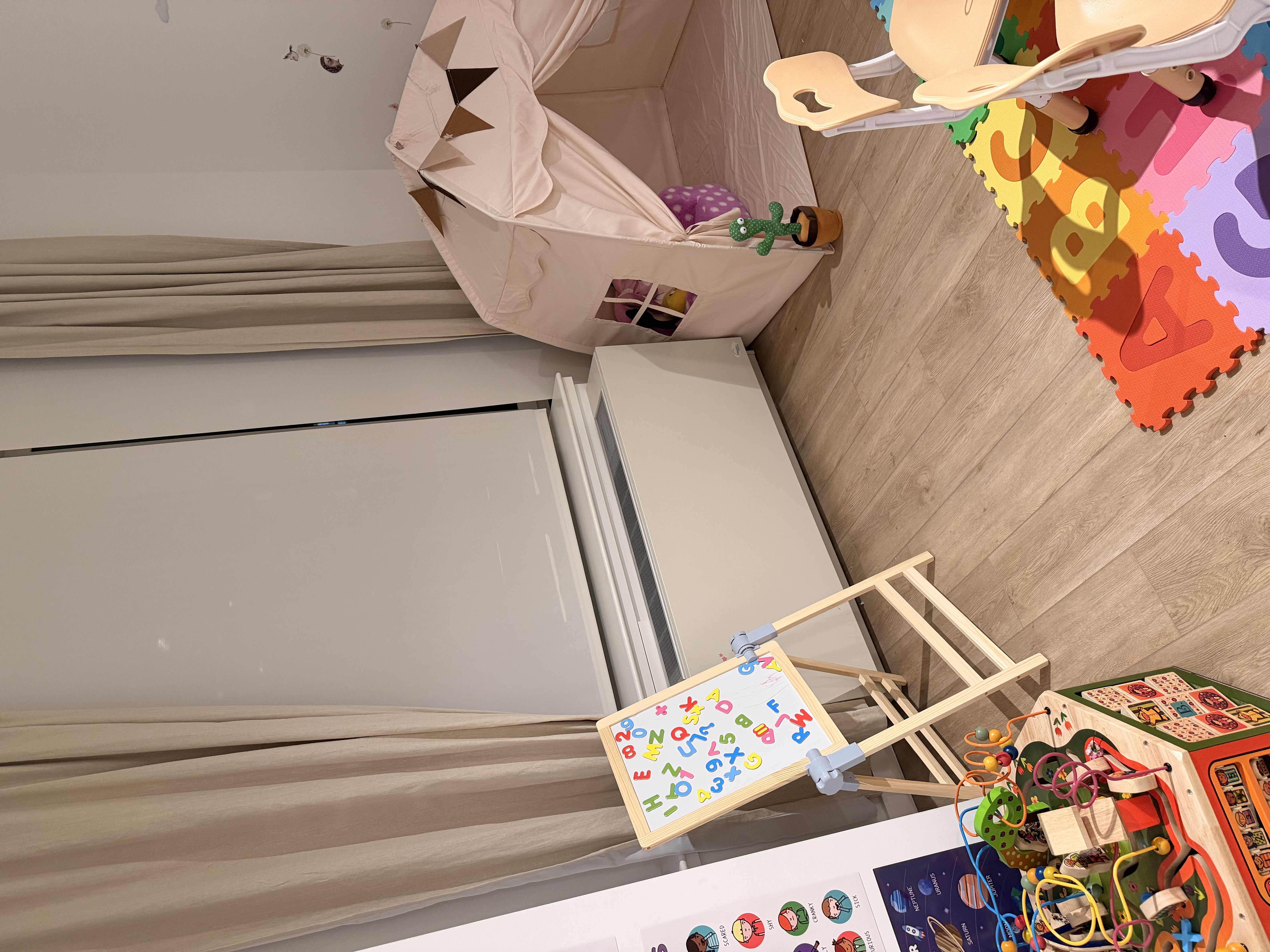 Bright play area with alphabet mats and learning toys